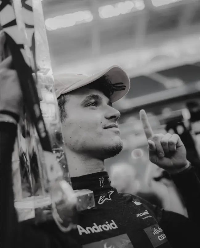 Lando lifting trophy